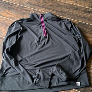 Peloton half zip size M runs small